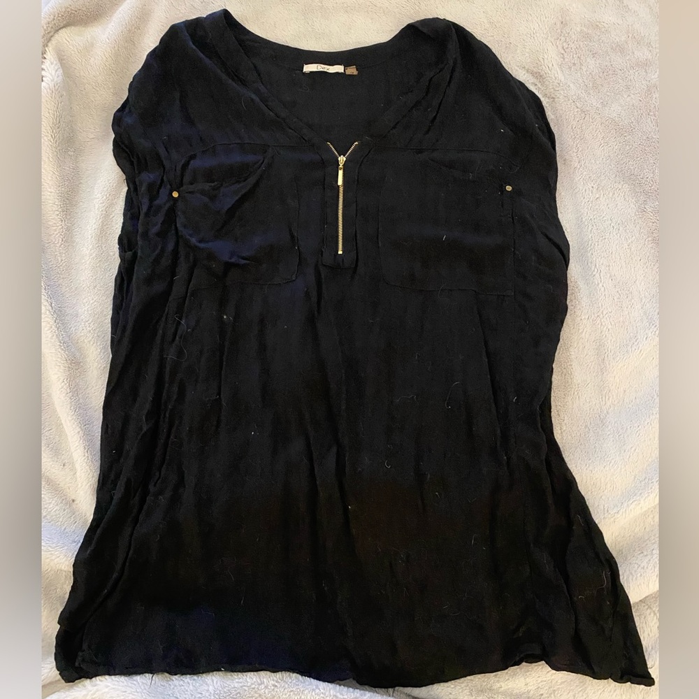 Black short sleeve top with gold zipper and front pockets